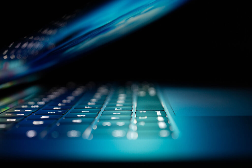 Dark laptop image to represent cybersecurity